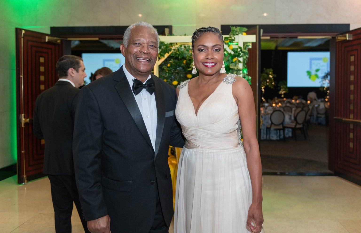 Salesia Smith-Gordon attends the Waves of Justice Gala hosted by the Legal Aid Society of Palm Beach County, posing with a guest at the formal fundraising event in support of access to justice programs.